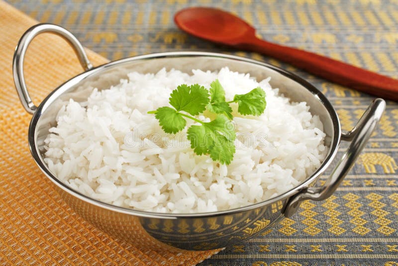 Basmati Rice med korianderleafen royaltyfria foton Basmati Rice med korianderleafen royaltyfria foton
