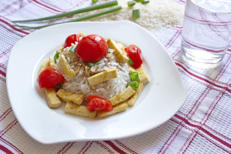 Basmati Rice with Pieces of Roasted Tofu, Tomatoes and Onion Stock