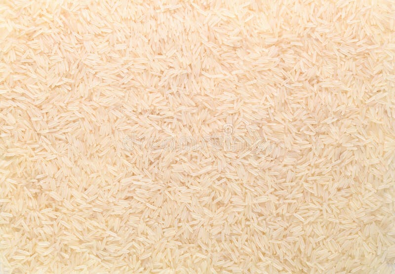 Basmati White Rice Solid Texture. Top View Closeup on Raw Rice Grains