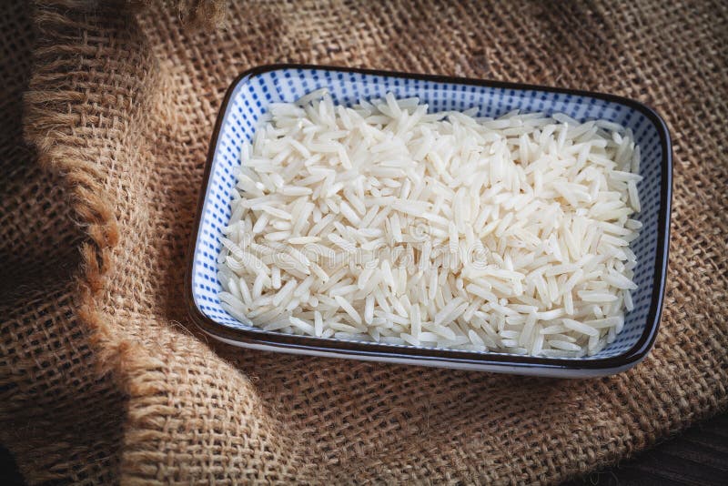 Basmati White Rice Solid Texture. Top View Closeup on Raw Rice Grains