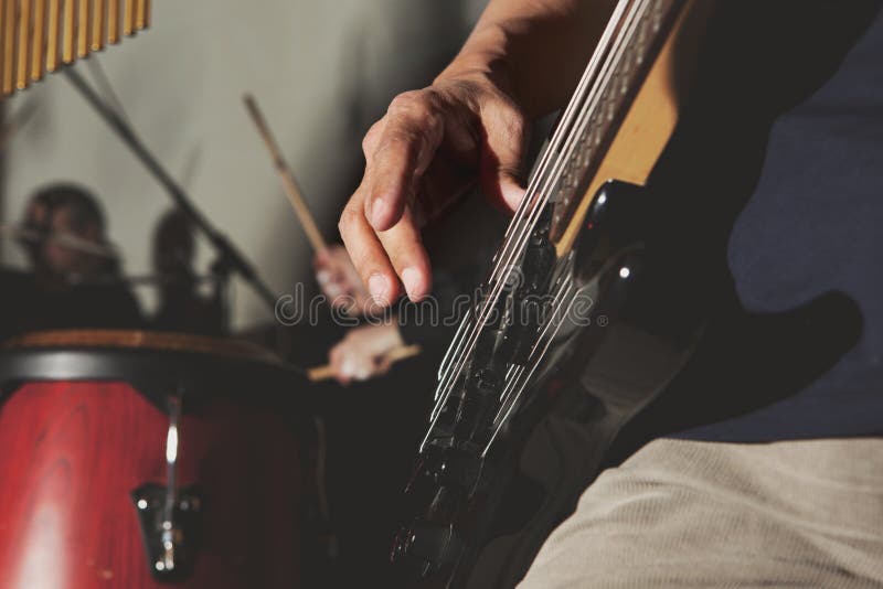 Bassguitar in male hands stock photo. Image of hard 18454100