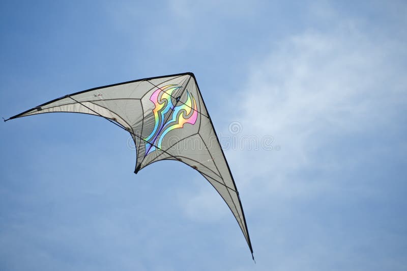 Bat winged kite races across the sky