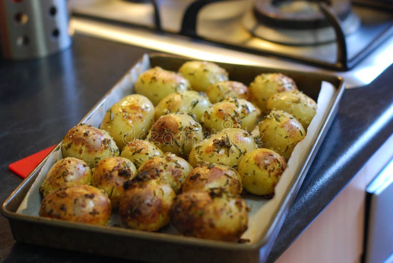 These mouthwatering roast potatoes have just come out of the oven and are ready to serve. These mouthwatering roast potatoes have just come out of the oven and are ready to serve.