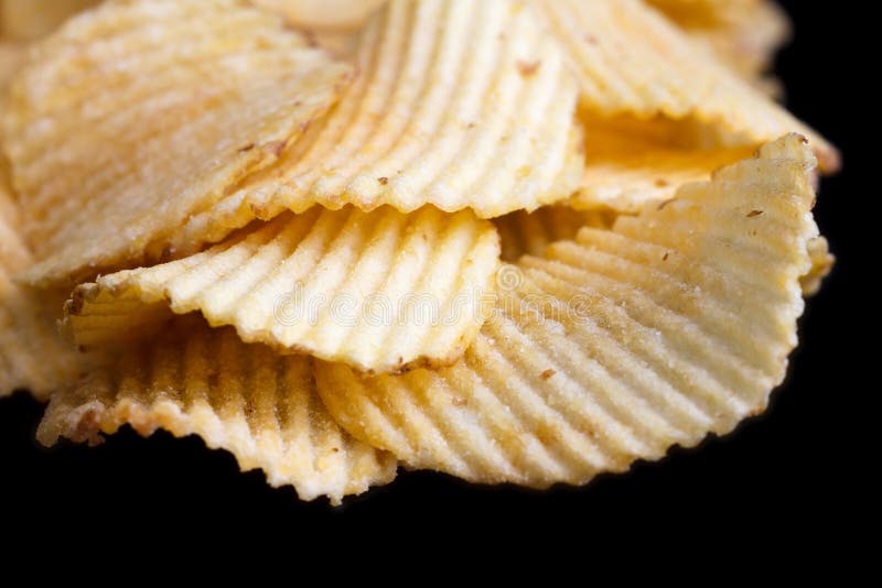 Batatas fritas de batata fritadas sulcadas imagem de stock Batatas fritas de batata fritadas sulcadas imagem de stock