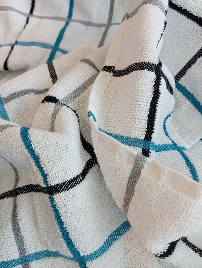White Dishtowel With Black Gray And Blue Stripes stock photography