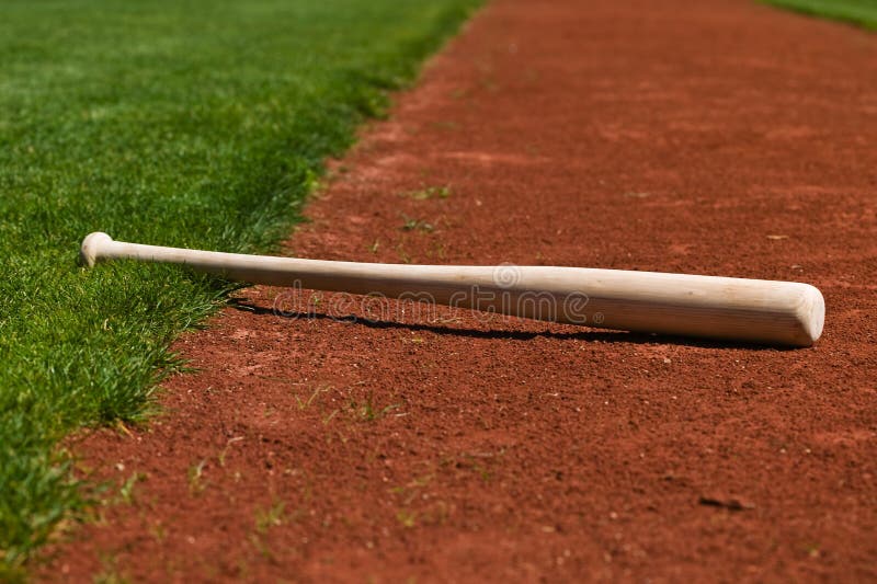 Baseball bat on a ball field. Baseball bat on a ball field