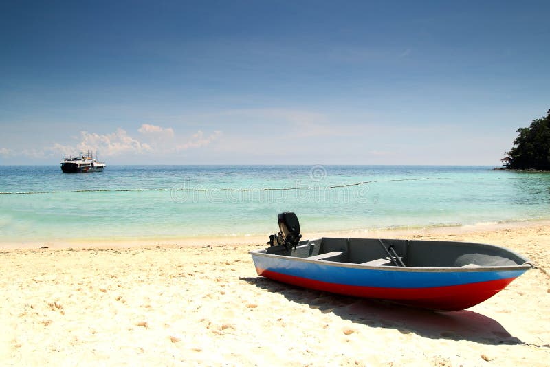 Fishing boat at beach with clear water during vacation. Fishing boat at beach with clear water during vacation