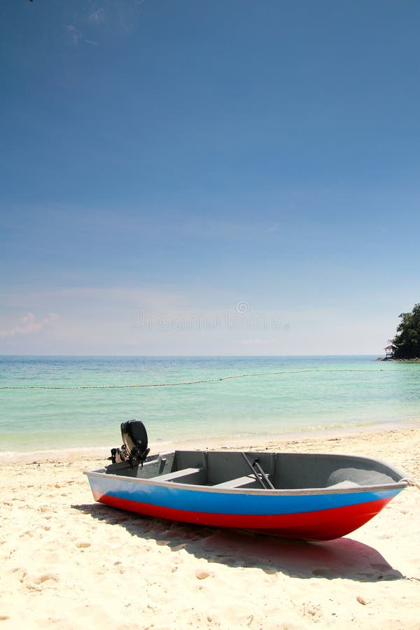 Fishing boat at beach with clear water during vacation. Fishing boat at beach with clear water during vacation