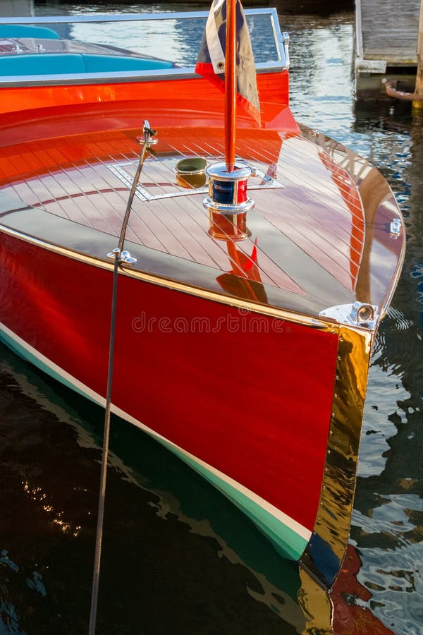 Vintage wooden boat moored alongside resort dock. Vintage wooden boat moored alongside resort dock