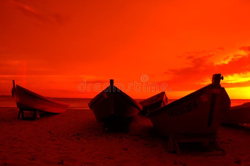 Boats sihlouetted against the sun. Boats sihlouetted against the sun.