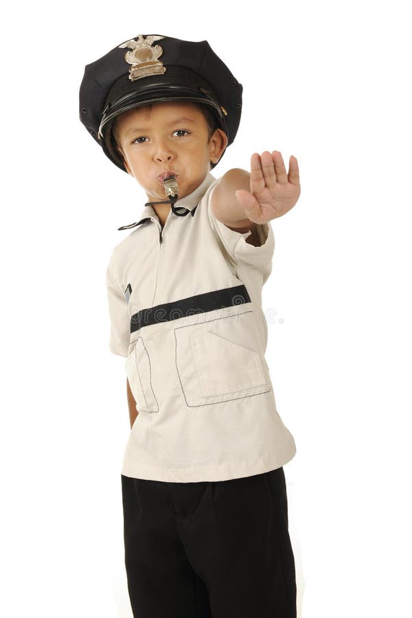 An adorable preschooler in a policeman's hat blowing his whistle and holding out his hand demanding traffic to stop. Isolated. An adorable preschooler in a policeman's hat blowing his whistle and holding out his hand demanding traffic to stop. Isolated.