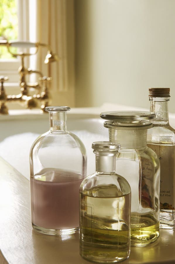 Bath Oil Bottles with Bubble Bathtub Stock Image Image of indoors