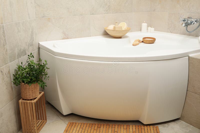 Bath with Personal Hygiene Accessories in Light Beige Bathroom Stock