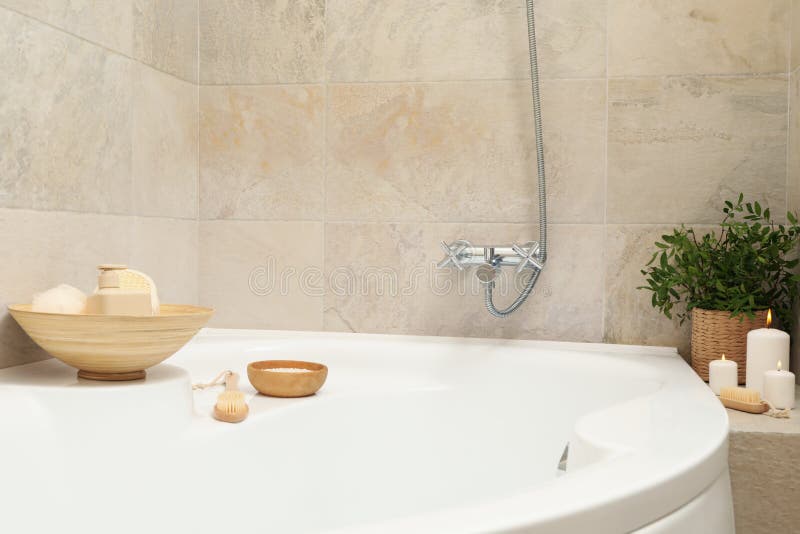Bath with Personal Hygiene Accessories in Light Beige Bathroom Stock
