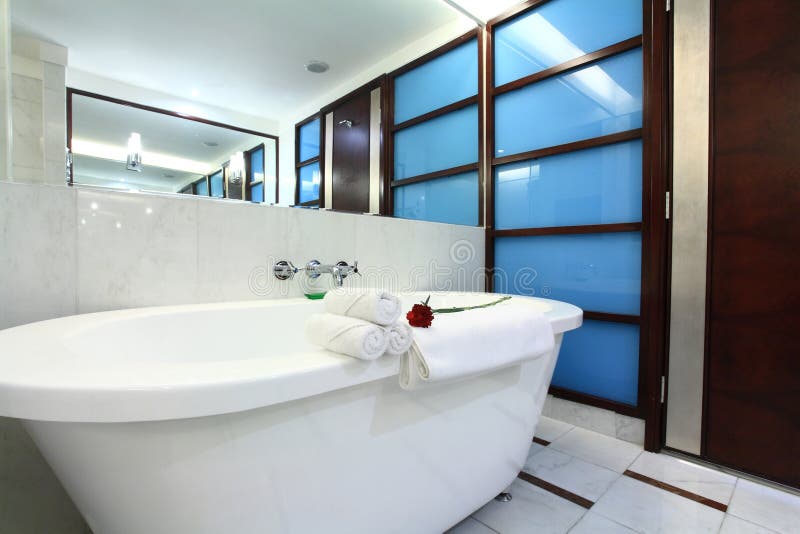 White bathtub with towel in bath room