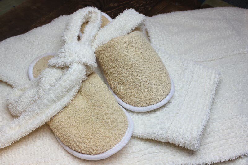 Bath slippers and bathrobe stock image. Image of hotel 131510557