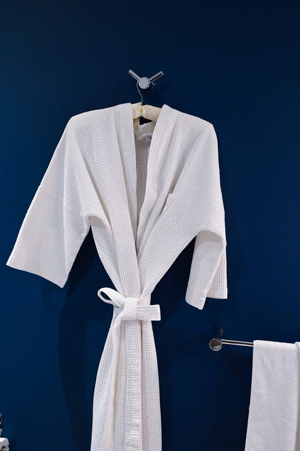 Bathrobe Hanging on Dark Blue Wall Stock Image Image of hanger