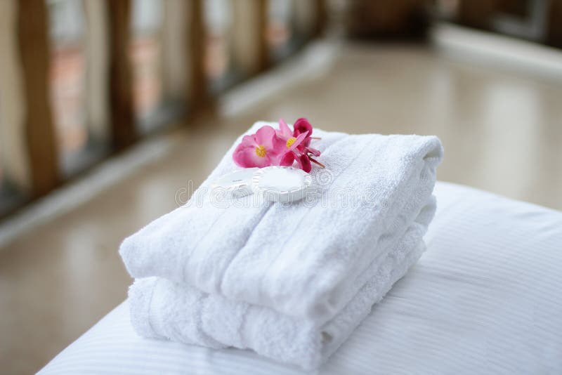 Hotel bed with bathrobe stock photo. Image of cushions 19997968