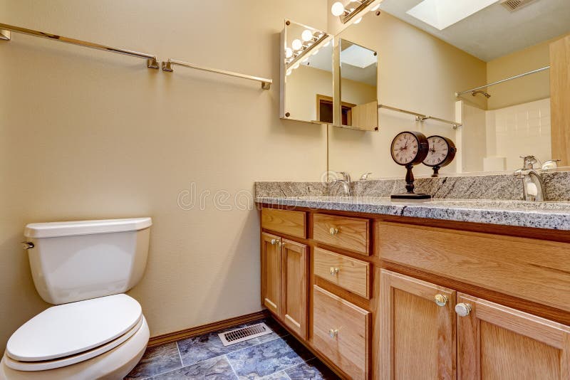 Bathroom with Granite Top Decoated with Clock Stock Image