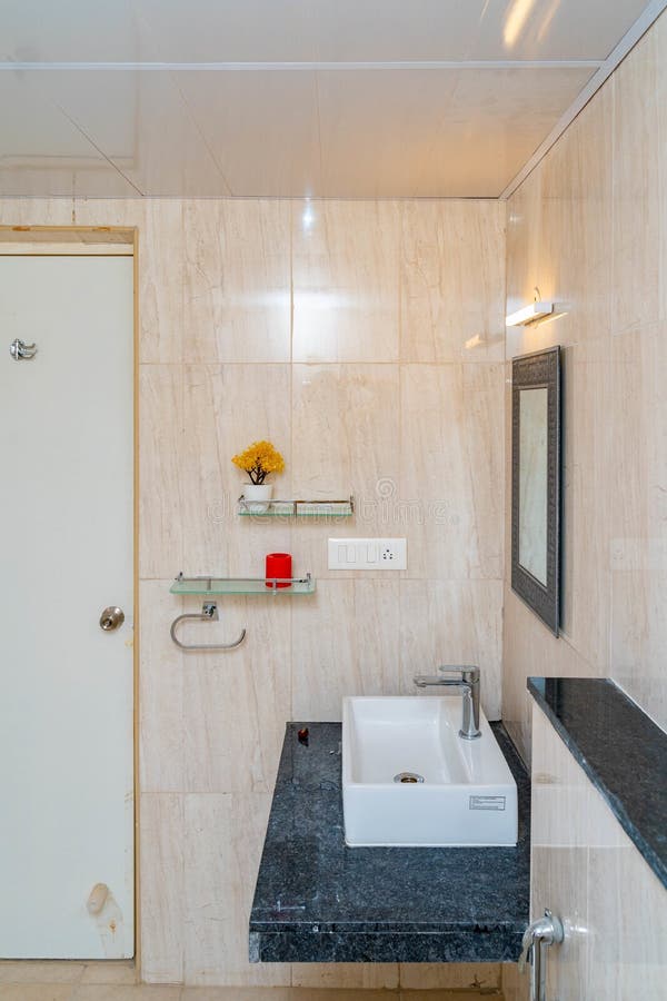 Bathroom with Ceramic Tile Walls and Marble Furniture Stock Image