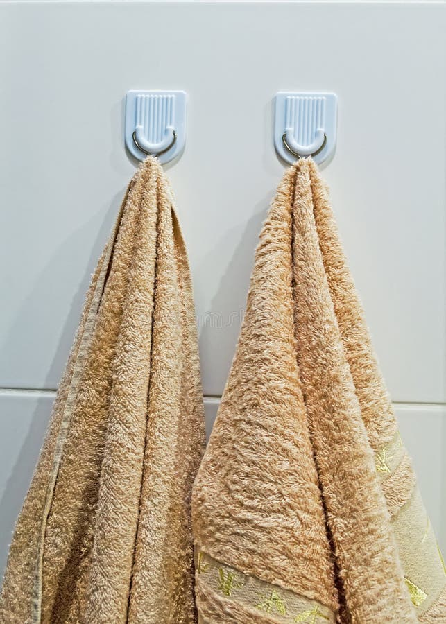 Bathroom Hooks with Hanging Beige Towels Stock Photo - Image of