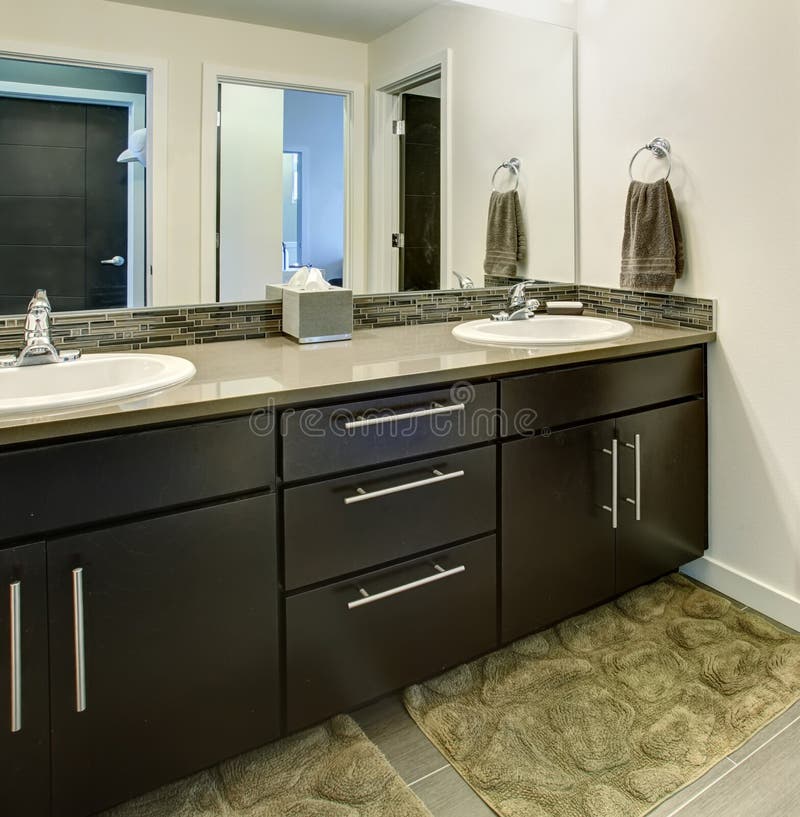 Bathroom interior with black cabinets, two sinks and large mirror. royalty free stock images Bathroom interior with black cabinets, two sinks and large mirror. royalty free stock images