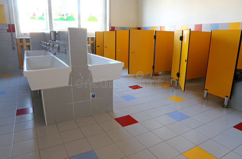 Bathroom of the Nursery School with White Ceramic Sinks Stock Image