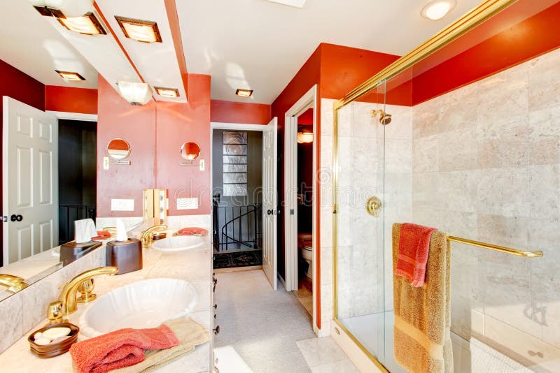 Bathroom with red walls and walk-in shower.