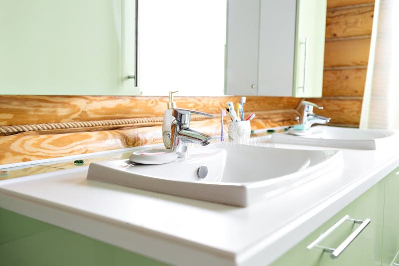 The bathroom in a rustic log cabin, in the mountains. with a beautiful interior. house of pine logs royalty free stock photos