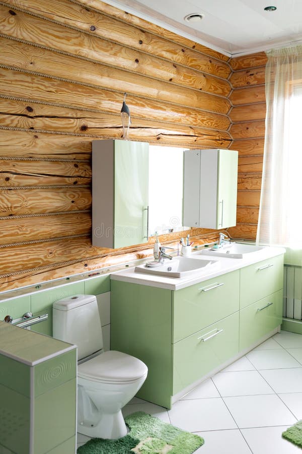 The bathroom in a rustic log cabin, in the mountains. with a beautiful interior. house of pine logs stock photo