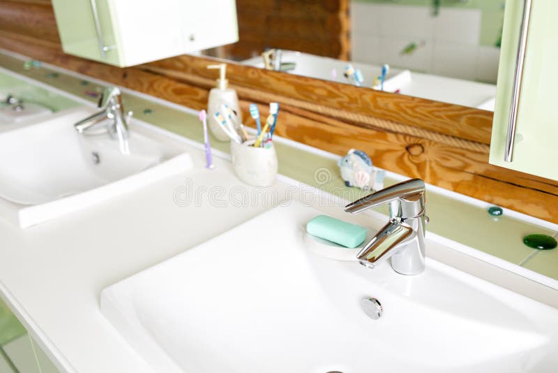 The bathroom in a rustic log cabin, in the mountains. with a beautiful interior. house of pine logs royalty free stock photos