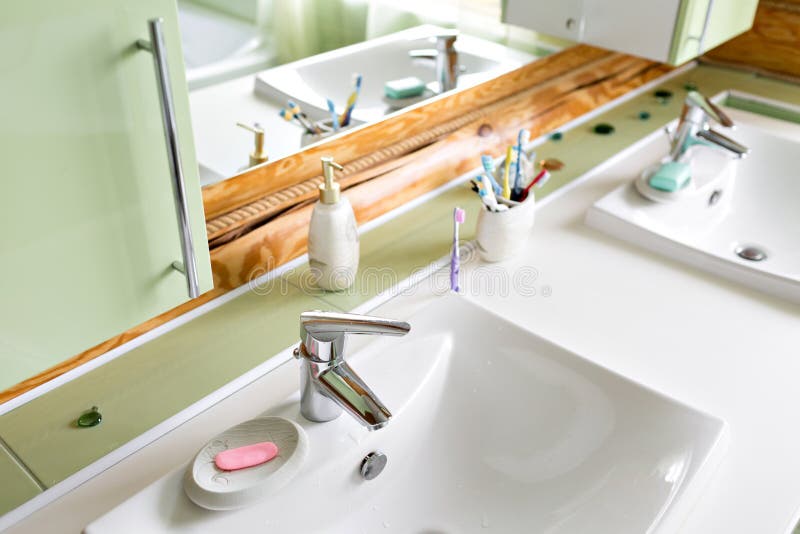 The bathroom in a rustic log cabin, in the mountains. with a beautiful interior. house of pine logs stock photo