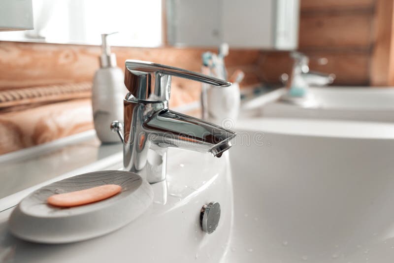 The bathroom in a rustic log cabin, in the mountains. with a beautiful interior. house of pine logs stock photography