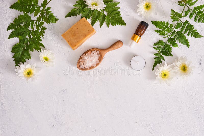 Bathroom salt, soap and aroma oil for spa on white background to