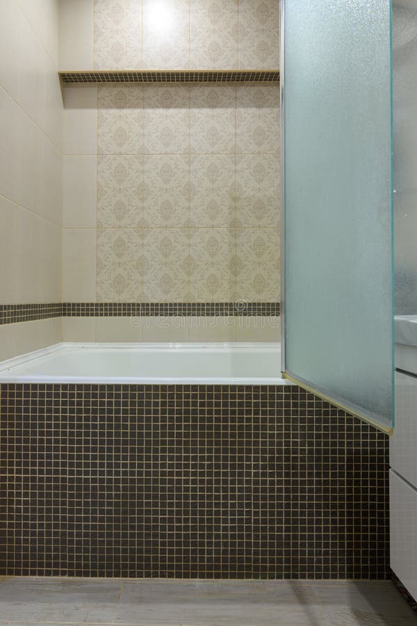 The Bathroom is Separated from the Bathroom by a Glass Partition, the