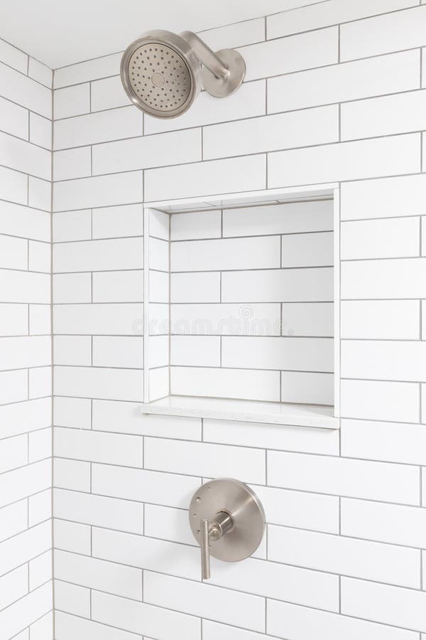 https://thumbs.dreamstime.com/b/bathroom-shower-detail-white-subway-tile-walls-built-niche-shelf-bronze-head-showerhead-tiles-299001492.jpg