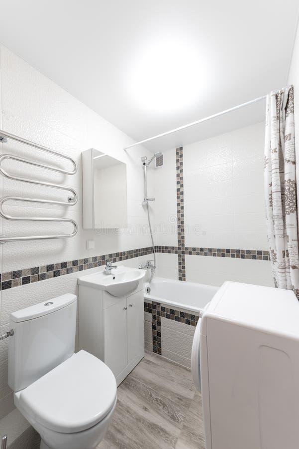 Bathroom with Shower, Washing Mashine and Water Closet Stock Image