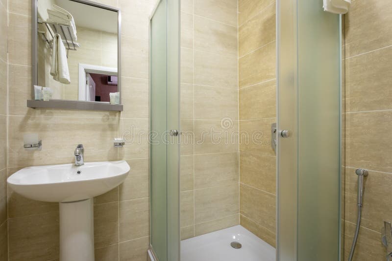 https://thumbs.dreamstime.com/b/bathroom-tiles-bright-colors-broom-shower-frosted-doors-mirror-above-sink-hanging-towel-over-toilet-h-hanger-138807889.jpg