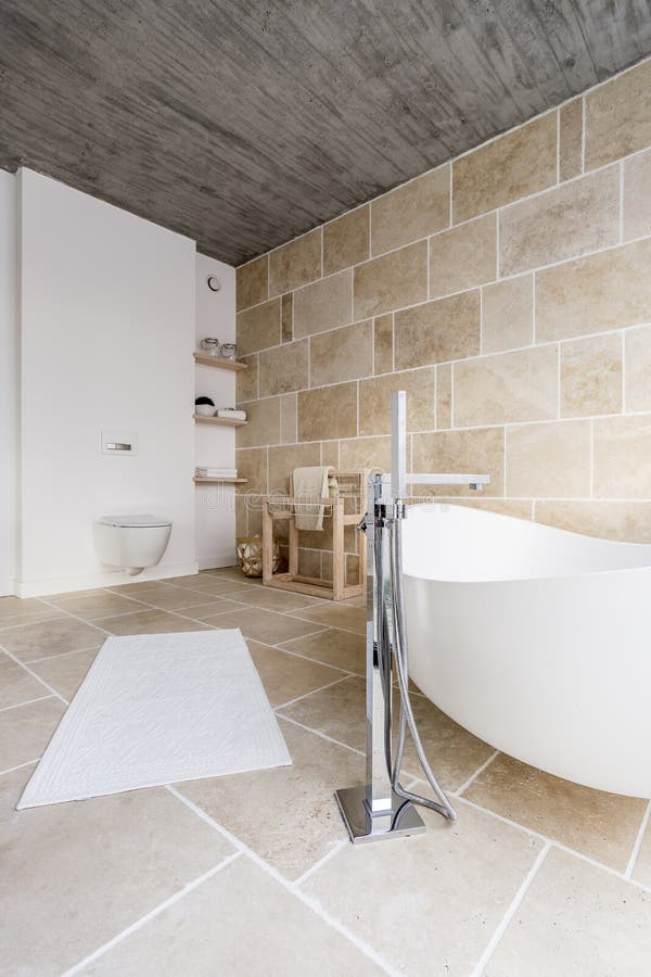 Bathtub in sand bathroom stock image. Image of interior - 108360793