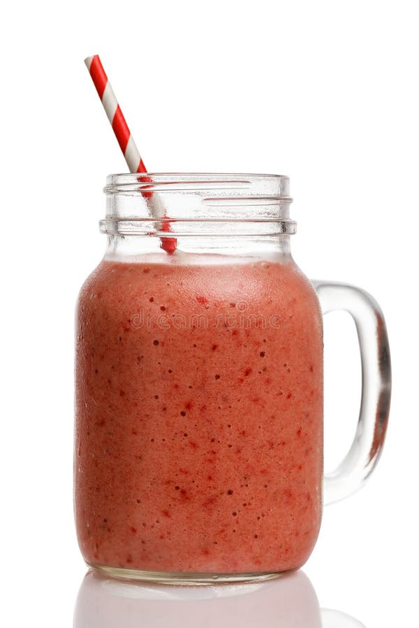 Batidos da morango com banana e morangos em um frasco de vidro imagens de stock royalty free Batidos da morango com banana e morangos em um frasco de vidro imagens de stock royalty free