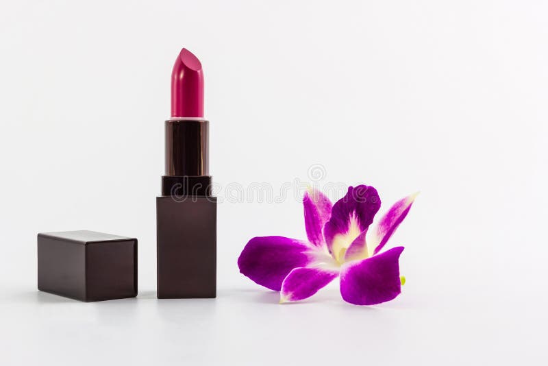 Batom roxo com trajeto de grampeamento e orquídea roxa. fotografia de stock Batom roxo com trajeto de grampeamento e orquídea roxa. fotografia de stock