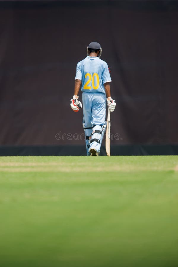 A batsman walking royalty free stock image