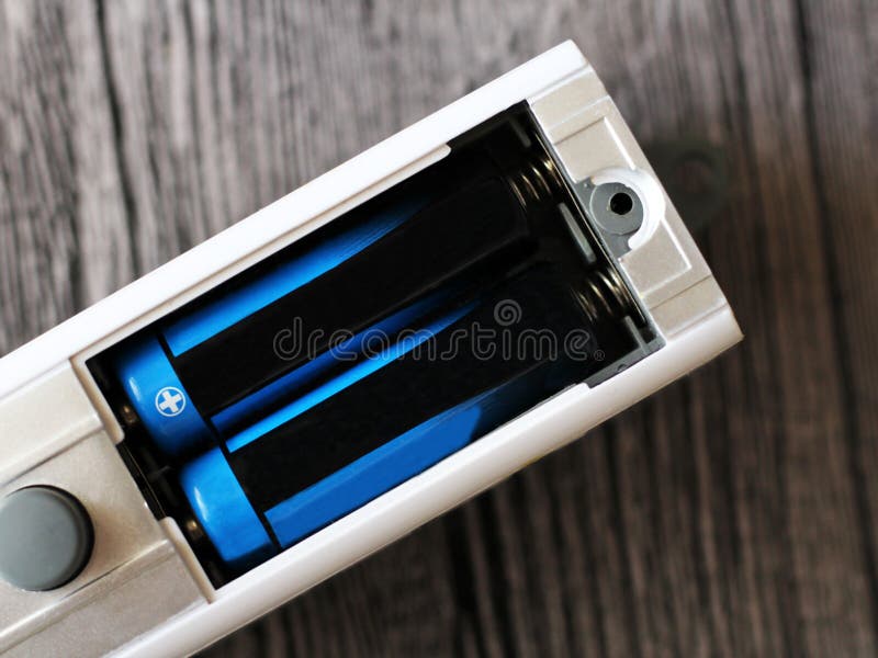 Batteries rechargeable in accumulator charger stock image