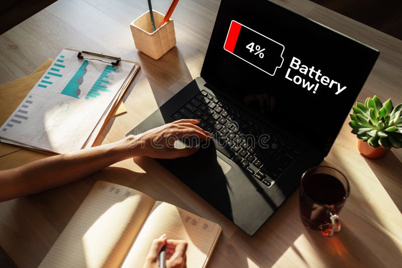 Battery low message on mobile device screen. Internet and technology concept.