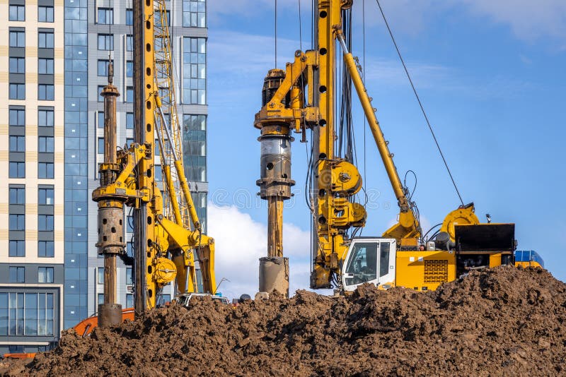 BAUER BG 36 rotary drilling rigs at the Plaza Botanica skyscraper construction site. Construction of bored piles for the