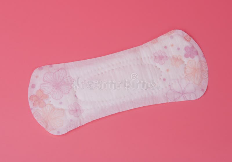 Baumwollmedizinisches Tuch oder -auflage für kritische Tage der Frauen auf Rosa stockbilder Baumwollmedizinisches Tuch oder -auflage für kritische Tage der Frauen auf Rosa stockbilder