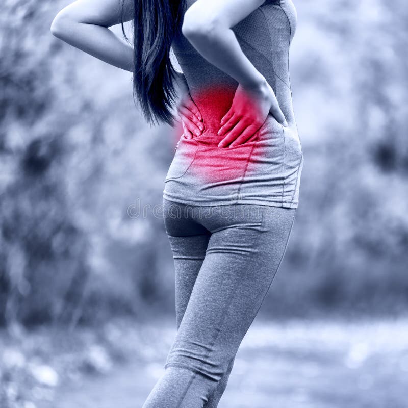 Sport woman hurting back problem - muscle pain injury. Active athlete runner massaging painful lower back because of hernial disc accident or muscular discomfort. Unrecognizable person in outdoors. Sport woman hurting back problem - muscle pain injury. Active athlete runner massaging painful lower back because of hernial disc accident or muscular discomfort. Unrecognizable person in outdoors.