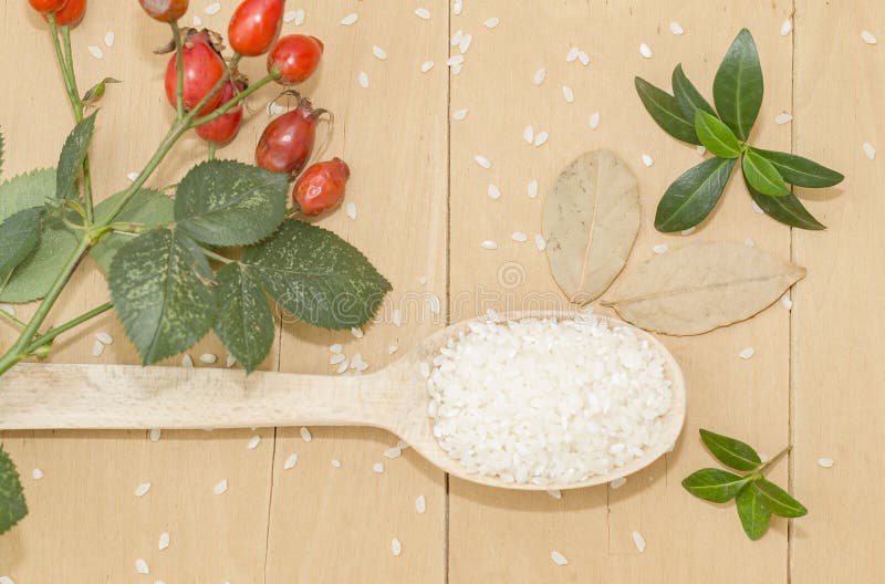 Bay Leaf, Dog Rose and a Wooden Spoon with Rice Stock Photo Image of