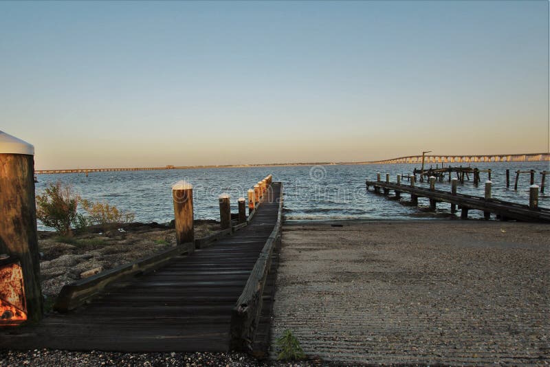 Bay of St. Louis eastern shore with a boat ramp in the foreground and the bridge as back ground