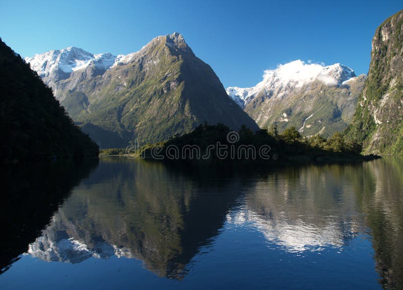 Bay surrounded by mountains royalty free stock photography